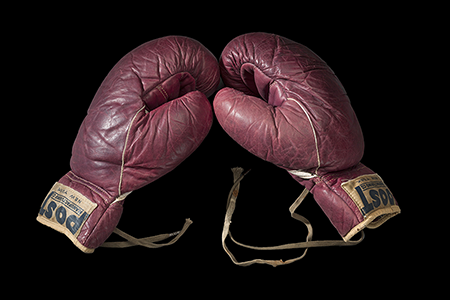 Training boxing gloves used and signed by Cassius Clay